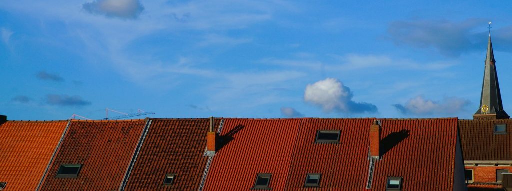 An image of a cozy attic space with thick layers of insulation covering the roof